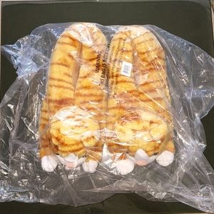 Brand New Discovery Channel Cat Slippers. Fits sizes 7-10 women's.